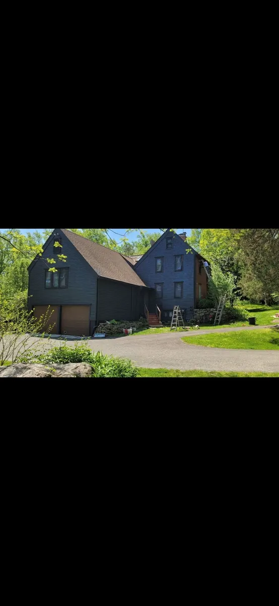 Freshly painted dark blue exterior of a Fairfield County home