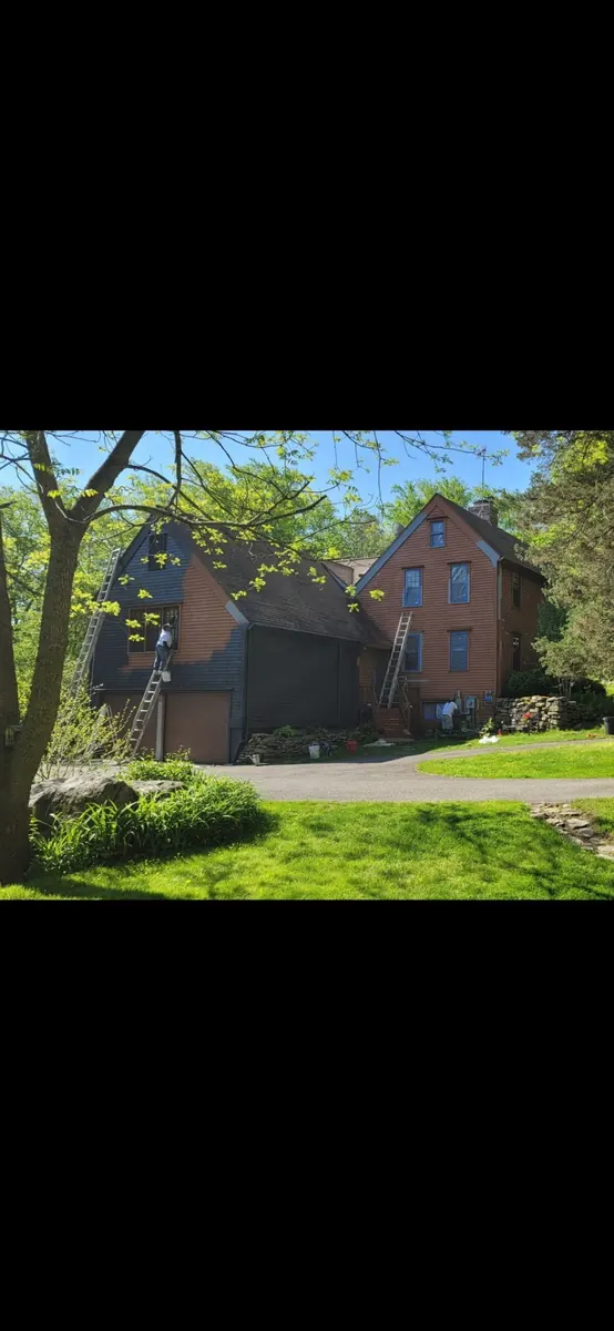 Brown-sided Fairfield County home before its exterior repaint